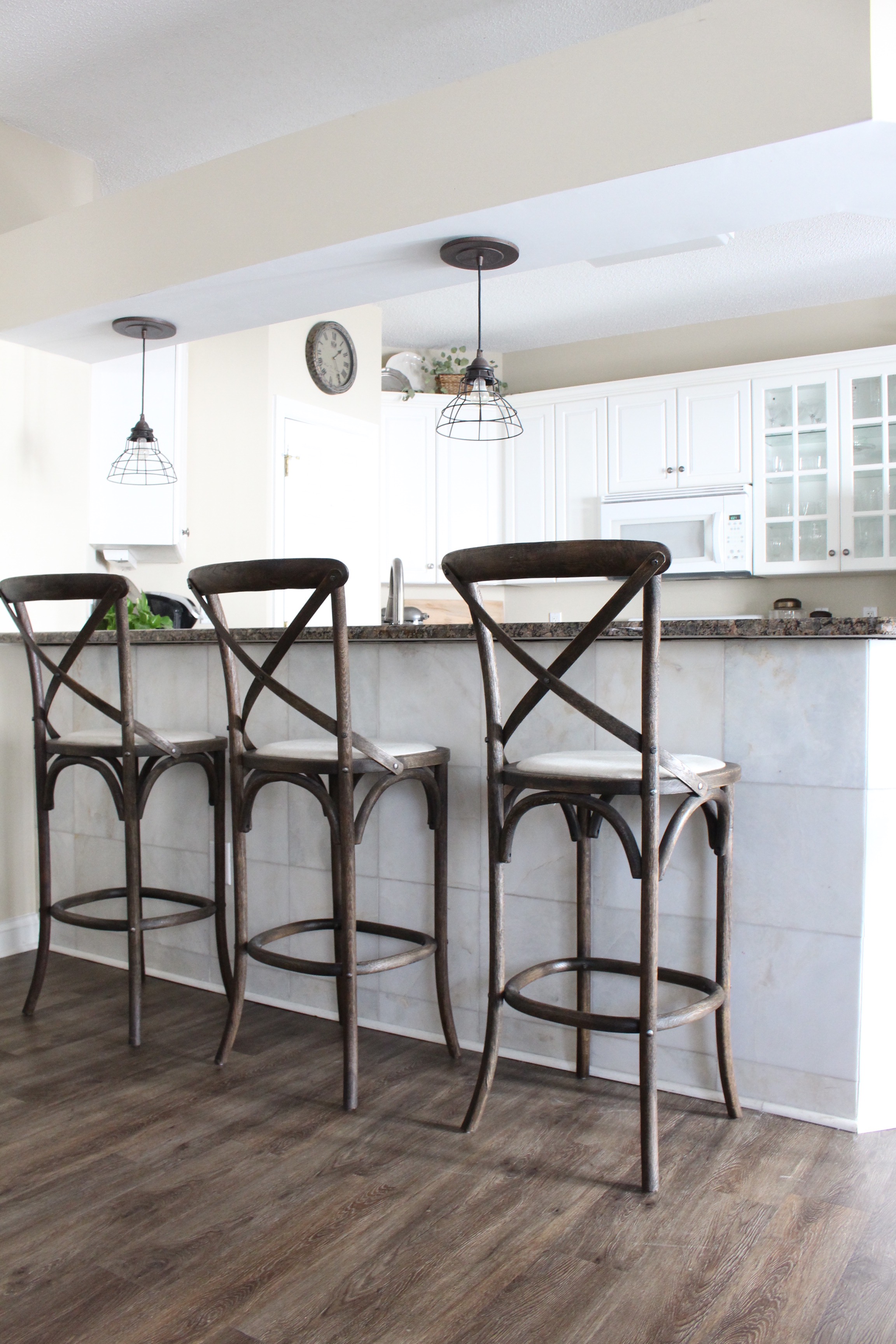 Our DIY Kitchen Lighting Update Reveal. Shop lighting, barstools, and more!