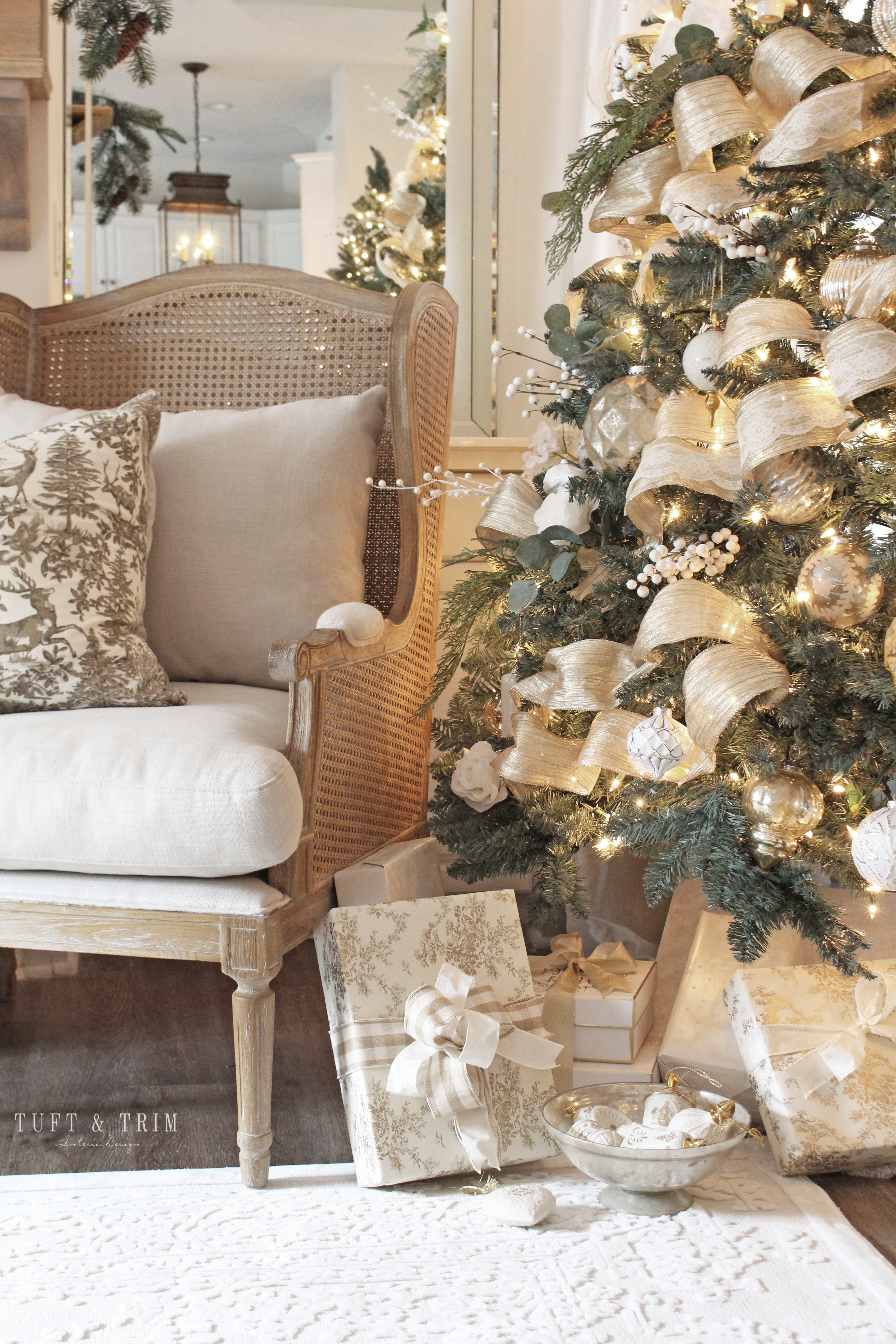 Elegant Christmas Tree with Floral and Gold by Tuft & Trim Interior Design